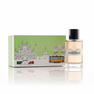 Perfume bottle with packaging featuring a cityscape design on a white background Goodbye Milano